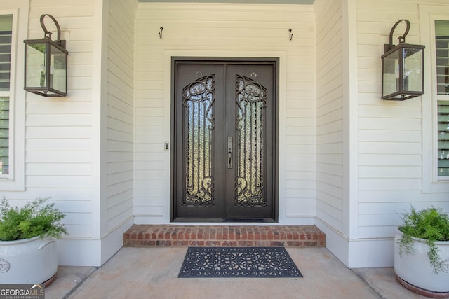 entrance to property featuring french doors