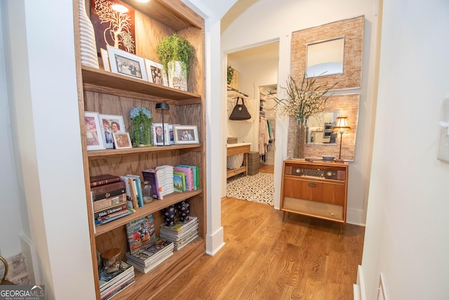 corridor with wood finished floors