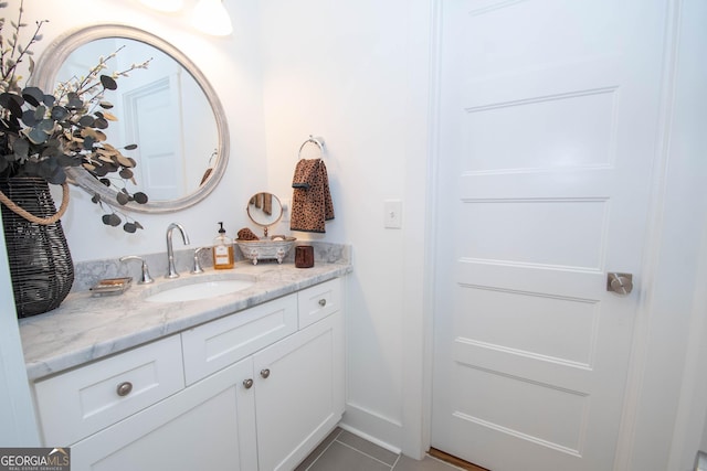 bathroom with vanity and tile patterned flooring