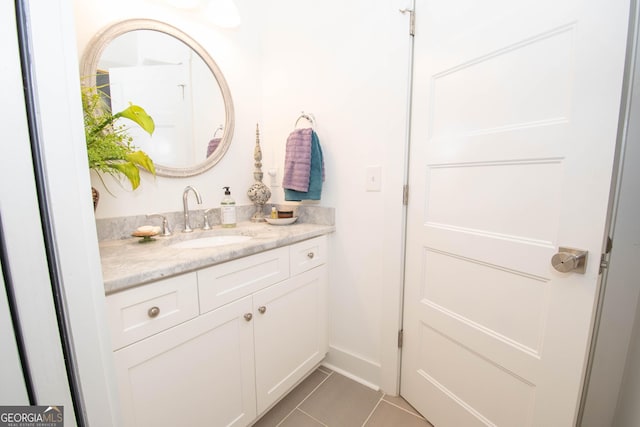 bathroom featuring tile patterned flooring and vanity