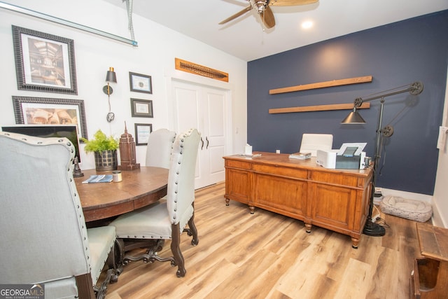 office featuring light wood-type flooring and a ceiling fan