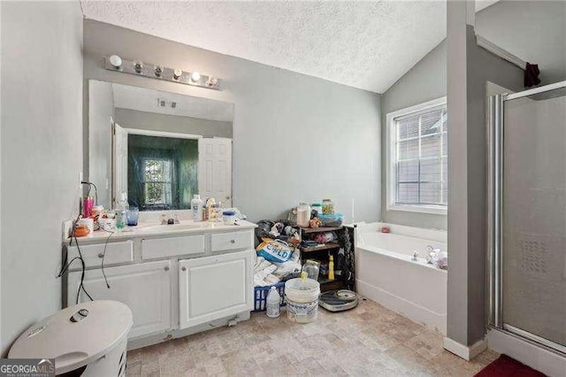415 Clairidge Ln SW, Lawrenceville, GA 30046 - full bath featuring a bath, lofted ceiling, a textured ceiling, and a stall shower
