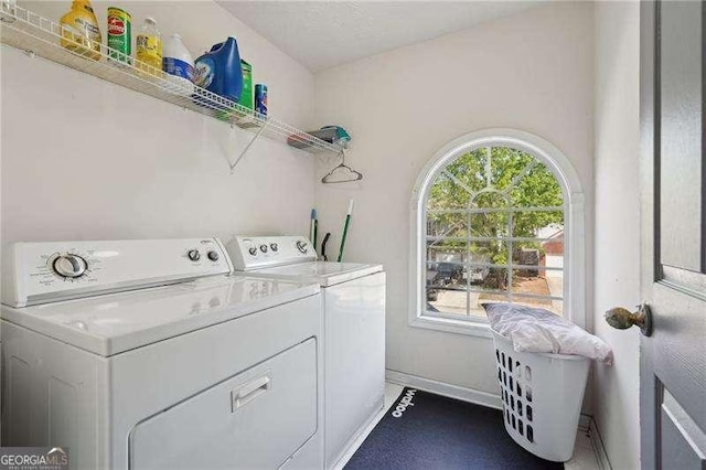 415 Clairidge Ln SW, Lawrenceville, GA 30046 - laundry room featuring washing machine and dryer, baseboards, and laundry area