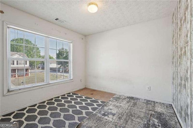 415 Clairidge Ln SW, Lawrenceville, GA 30046 - carpeted empty room featuring a textured ceiling, baseboards, and visible vents