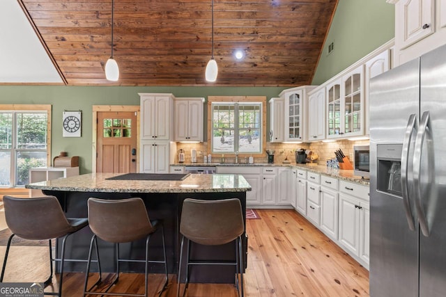 210 Lake Pines Rd, Jackson, GA 30233 - kitchen with a healthy amount of sunlight, appliances with stainless steel finishes, lofted ceiling, and wood ceiling