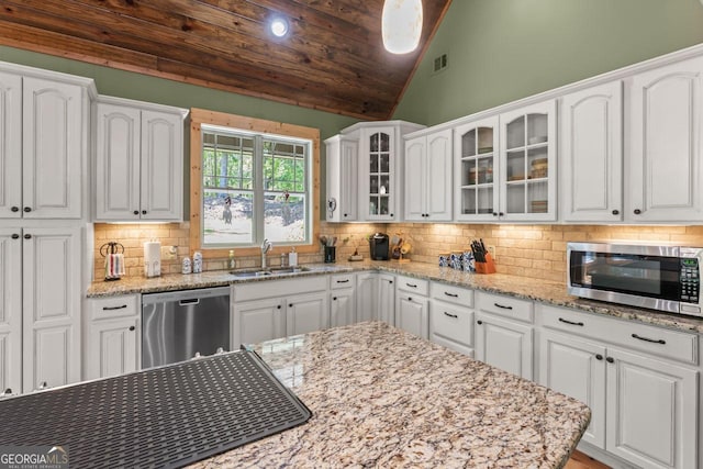 210 Lake Pines Rd, Jackson, GA 30233 - kitchen with stainless steel appliances, white cabinets, glass insert cabinets, and a sink