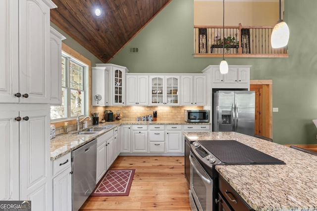 210 Lake Pines Rd, Jackson, GA 30233 - kitchen featuring light wood-style flooring, wood ceiling, appliances with stainless steel finishes, a sink, and white cabinetry