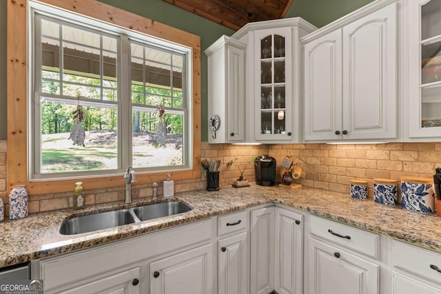 210 Lake Pines Rd, Jackson, GA 30233 - kitchen with glass insert cabinets, a sink, and white cabinetry