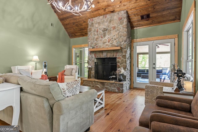210 Lake Pines Rd, Jackson, GA 30233 - living room with a chandelier, high vaulted ceiling, wood ceiling, hardwood / wood-style floors, and french doors