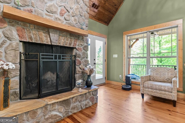 210 Lake Pines Rd, Jackson, GA 30233 - living room with hardwood / wood-style floors, baseboards, wooden ceiling, a fireplace, and a wealth of natural light
