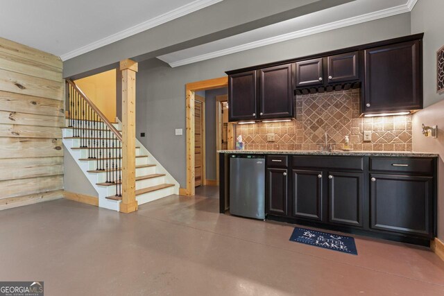 210 Lake Pines Rd, Jackson, GA 30233 - kitchen featuring a sink, light stone counters, backsplash, finished concrete floors, and ornamental molding