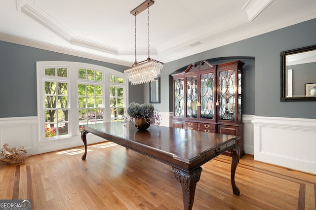 3190 Shumard Way, Marietta, GA 30064 - dining room with wood finished floors, a tray ceiling, a wainscoted wall, and crown molding