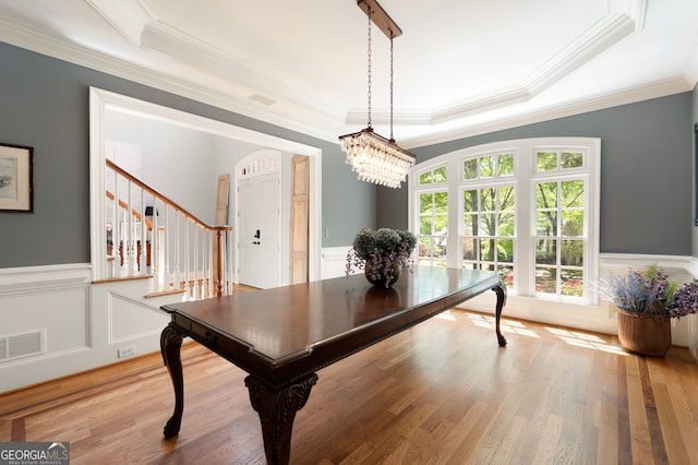 3190 Shumard Way, Marietta, GA 30064 - dining space featuring light wood-type flooring, visible vents, stairs, crown molding, and a raised ceiling