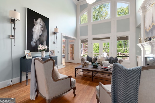 3190 Shumard Way, Marietta, GA 30064 - living room featuring light wood-type flooring, a high ceiling, and french doors