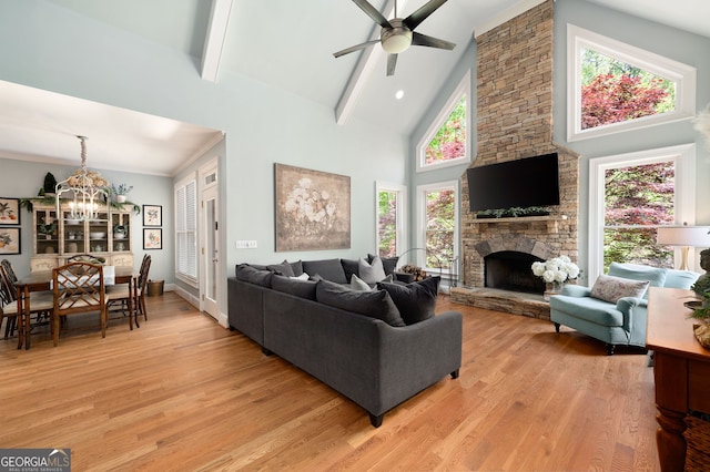3190 Shumard Way, Marietta, GA 30064 - living room featuring high vaulted ceiling, a wealth of natural light, ceiling fan with notable chandelier, and light wood-style flooring