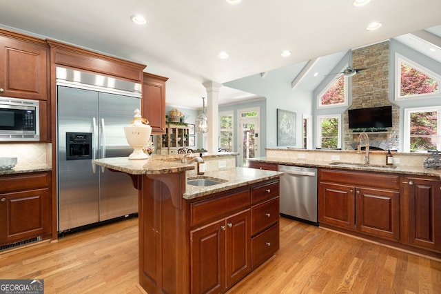 3190 Shumard Way, Marietta, GA 30064 - kitchen with backsplash, light wood-style flooring, built in appliances, and a sink