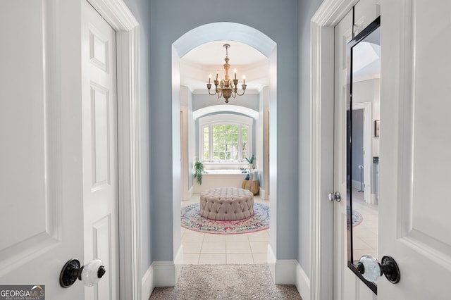 3190 Shumard Way, Marietta, GA 30064 - interior space featuring tile patterned floors, an inviting chandelier, ornamental molding, arched walkways, and carpet floors