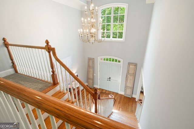 3190 Shumard Way, Marietta, GA 30064 - foyer with crown molding, wood finished floors, stairs, a chandelier, and baseboards