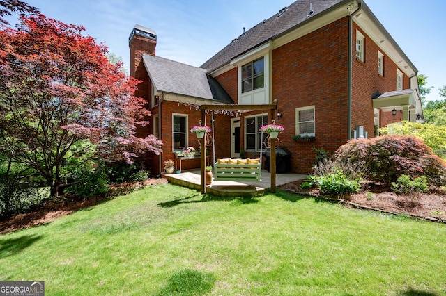 3190 Shumard Way, Marietta, GA 30064 - back of property featuring a patio area, a chimney, a yard, brick siding, and roof with shingles