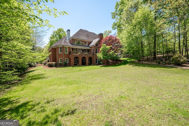 3190 Shumard Way, Marietta, GA 30064 - back of property with a chimney, brick siding, and a yard