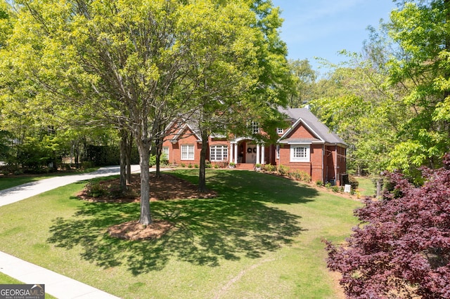 3190 Shumard Way, Marietta, GA 30064 - view of property hidden behind natural elements featuring a front lawn and brick siding