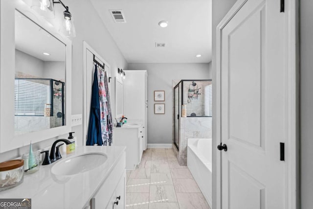 104 Federal Path, Temple, GA 30179 - bathroom featuring a stall shower, marble look tile flooring, two vanities, a bath, and recessed lighting