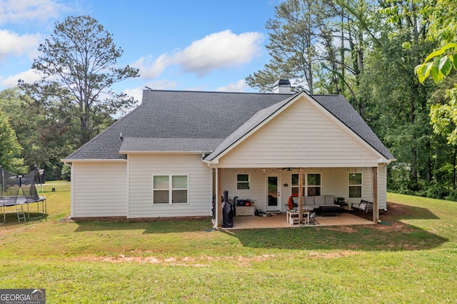 104 Federal Path, Temple, GA 30179 - rear view of house with a trampoline, outdoor lounge area, a patio, a lawn, and a ceiling fan