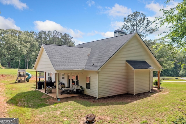 104 Federal Path, Temple, GA 30179 - rear view of house with a shingled roof, a yard, and a patio