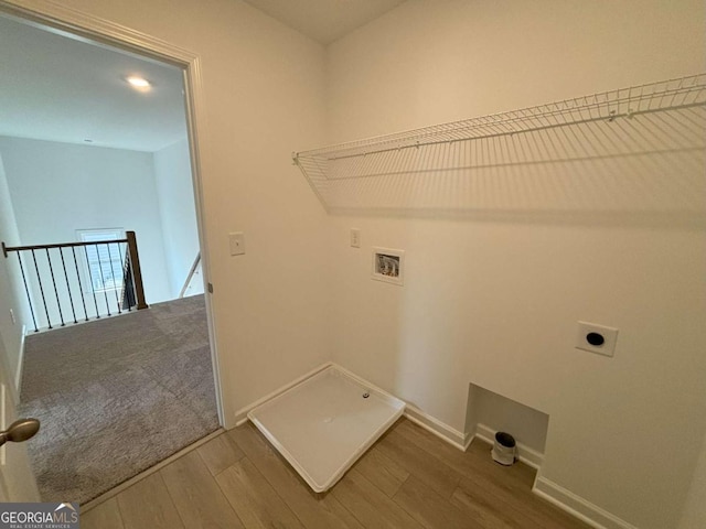 washroom featuring laundry area, wood finished floors, baseboards, electric dryer hookup, and washer hookup