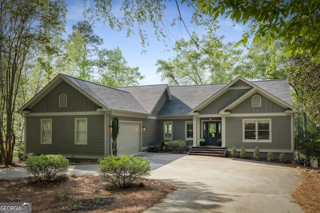 1630 Dogwood Dr, Greensboro, GA 30642 - view of front of house featuring an attached garage, a shingled roof, driveway, and board and batten siding