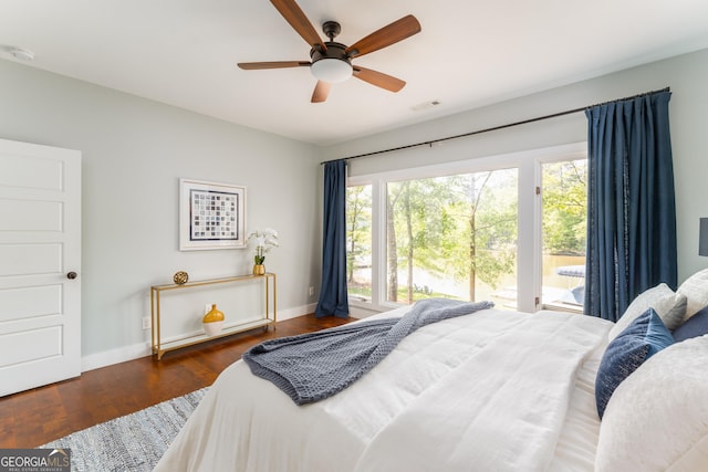 1630 Dogwood Dr, Greensboro, GA 30642 - bedroom featuring baseboards, wood finished floors, visible vents, and a ceiling fan