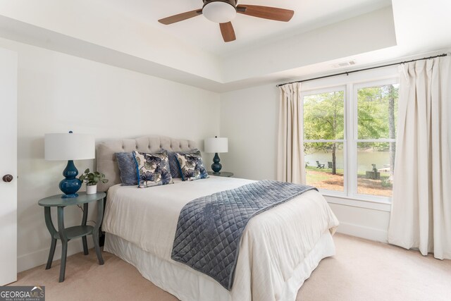 1630 Dogwood Dr, Greensboro, GA 30642 - carpeted bedroom with baseboards, a raised ceiling, and ceiling fan