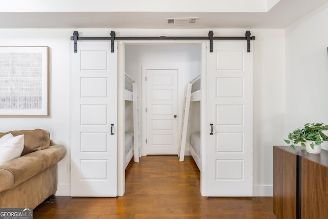 1630 Dogwood Dr, Greensboro, GA 30642 - sitting room featuring visible vents, dark wood-type flooring, and a barn door