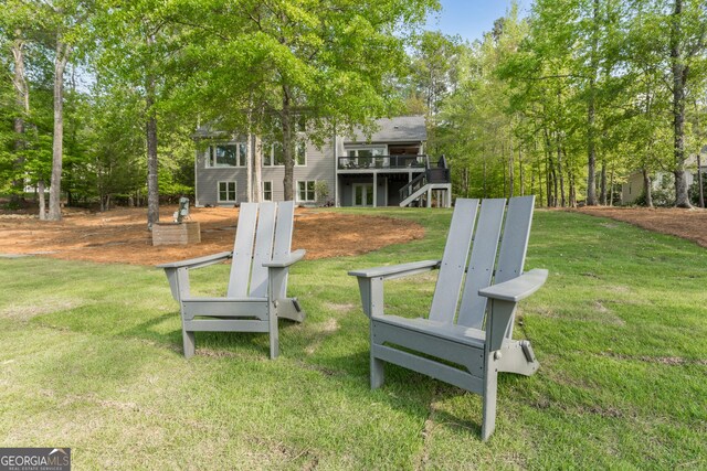 1630 Dogwood Dr, Greensboro, GA 30642 - view of property's community featuring a wooden deck, a lawn, and stairs