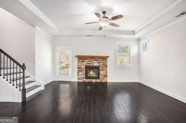 5749 Creek Indian Dr, Sugar Hill, GA 30518 - unfurnished living room featuring a ceiling fan, visible vents, dark wood-type flooring, and a stone fireplace