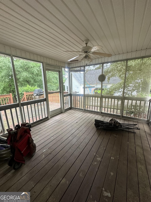 sunroom with a ceiling fan