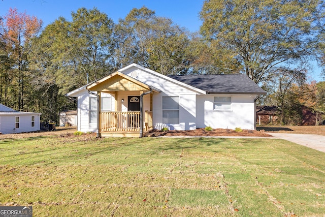 bungalow-style home with a porch and a front lawn
