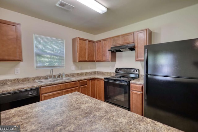 11224 Aliyah Dr, Hampton, GA 30228 - kitchen with under cabinet range hood, light countertops, visible vents, a sink, and black appliances