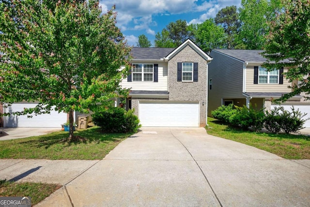 11224 Aliyah Dr, Hampton, GA 30228 - view of front of house featuring driveway, brick siding, and a garage