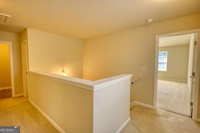 11224 Aliyah Dr, Hampton, GA 30228 - hall featuring baseboards, an upstairs landing, and carpet