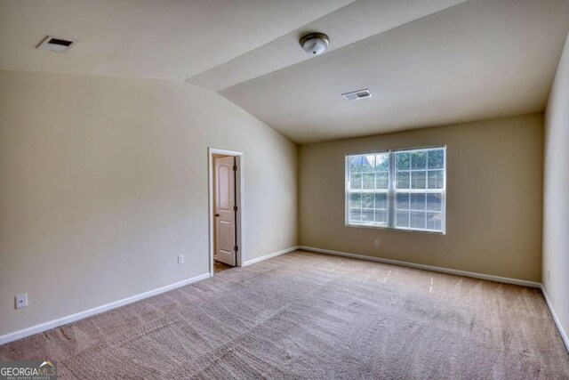 11224 Aliyah Dr, Hampton, GA 30228 - unfurnished room featuring baseboards, vaulted ceiling, visible vents, and carpet flooring