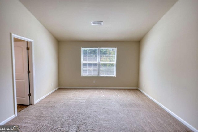 11224 Aliyah Dr, Hampton, GA 30228 - empty room featuring light carpet, visible vents, and baseboards