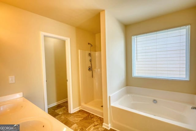 11224 Aliyah Dr, Hampton, GA 30228 - full bathroom featuring a garden tub, a sink, a shower, and double vanity