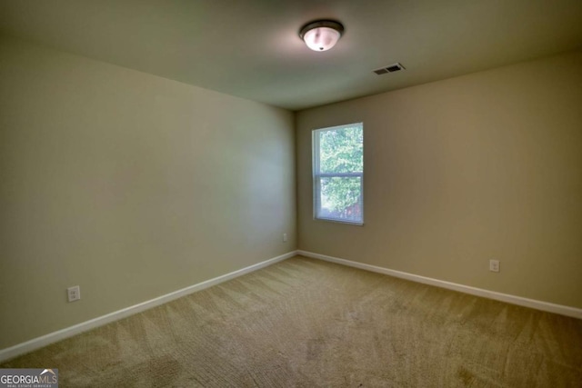 11224 Aliyah Dr, Hampton, GA 30228 - carpeted spare room with baseboards and visible vents