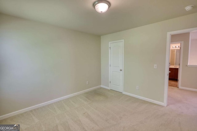 11224 Aliyah Dr, Hampton, GA 30228 - unfurnished bedroom featuring light colored carpet and baseboards