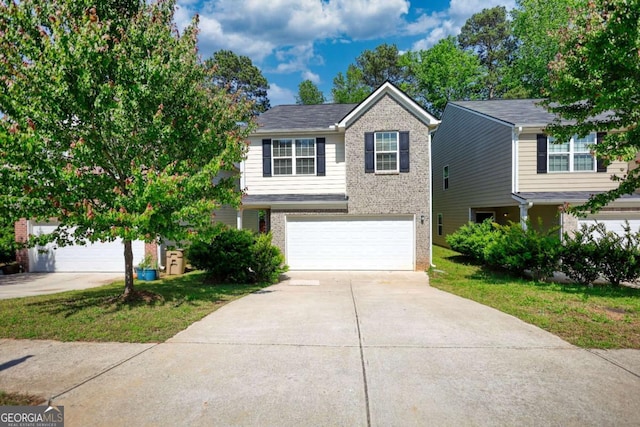 11224 Aliyah Dr, Hampton, GA 30228 - view of front of property with brick siding, driveway, and a garage