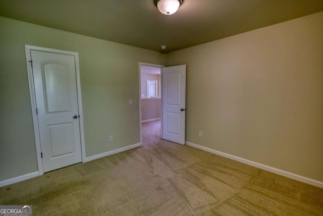 11224 Aliyah Dr, Hampton, GA 30228 - unfurnished bedroom featuring carpet flooring and baseboards