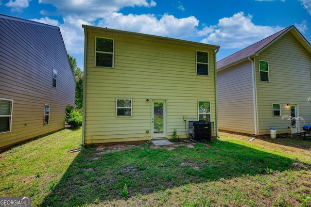 11224 Aliyah Dr, Hampton, GA 30228 - rear view of house featuring a lawn and central AC unit