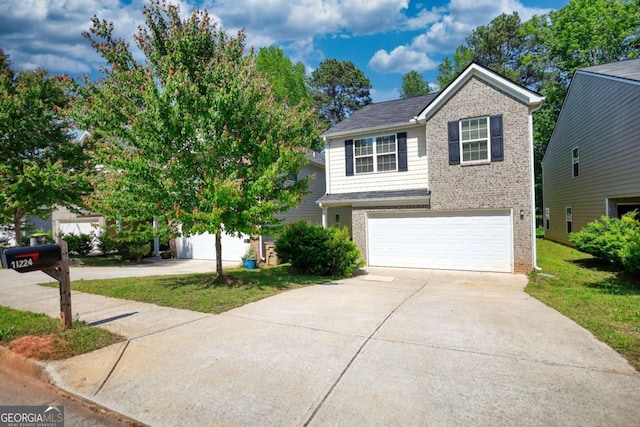 11224 Aliyah Dr, Hampton, GA 30228 - traditional-style house featuring concrete driveway, an attached garage, brick siding, and a front lawn