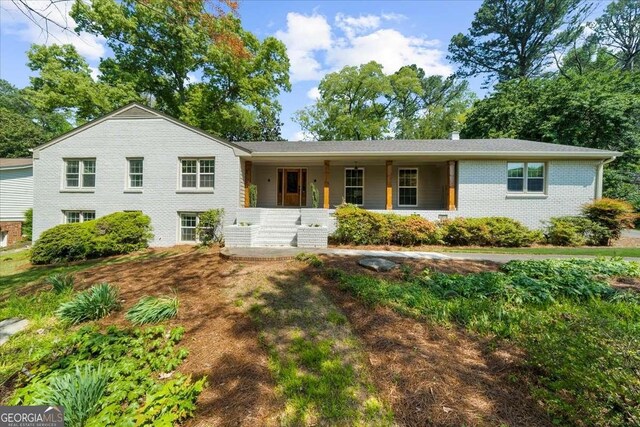 7300 Wynhill Dr, Sandy Springs, GA 30328 - view of front of house with covered porch and brick siding